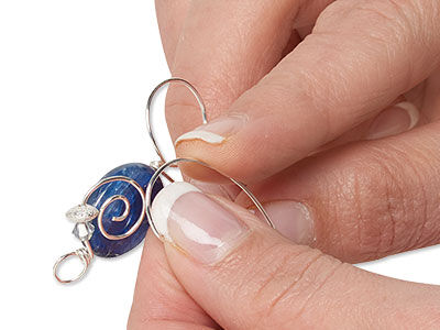Wire being wrapped around a bead